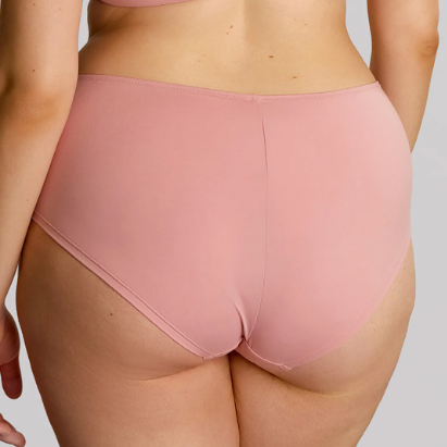 Person wearing pink underwear on a plain background