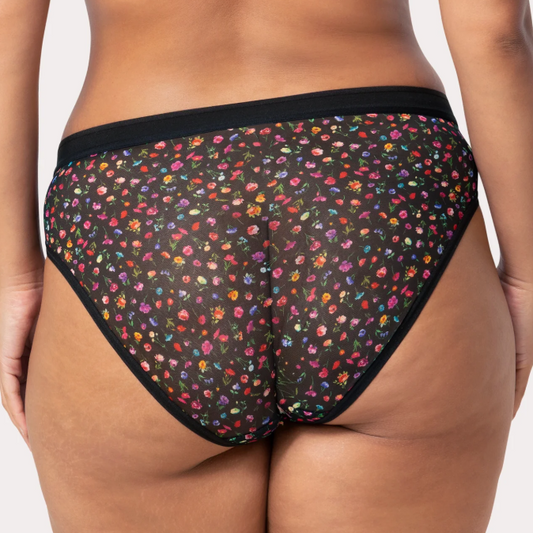 Colorful floral-patterned underwear on a plain background