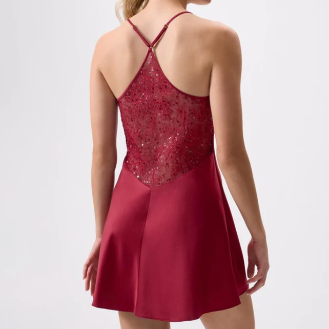 Red chemise with lace detailing on a white background