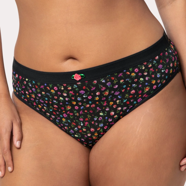 Black floral-patterned underwear on a plain background