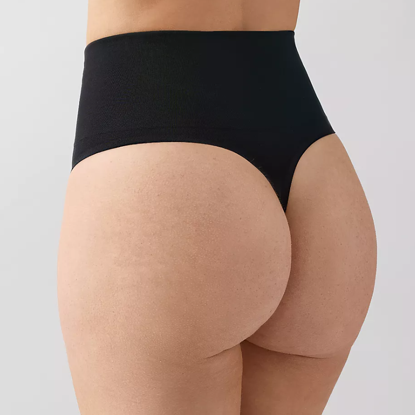 Black high-waisted underwear on a plain background