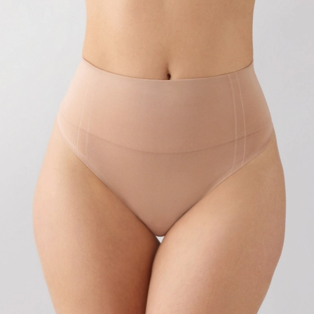 Beige shapewear worn by a person on a light gray background