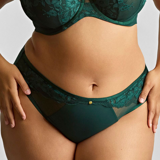Green lace lingerie set on a neutral background