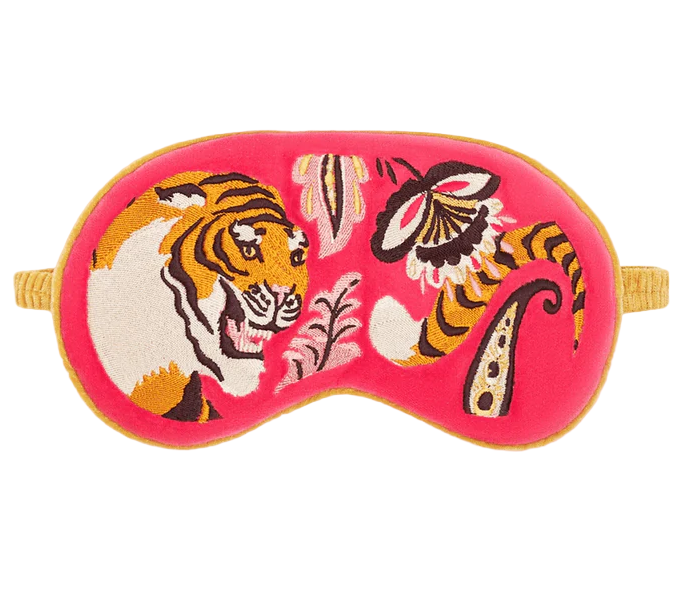Sleep mask with tiger design on a pink background
